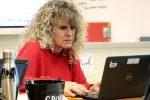 Milford Education Association President Kristin Galati works on her laptop