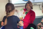 Kizzy Perkins reads to students