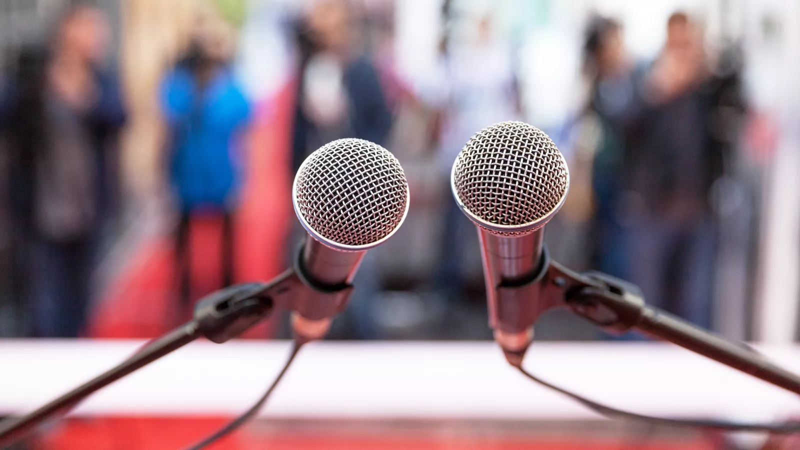 First-person view of microphones on a podium