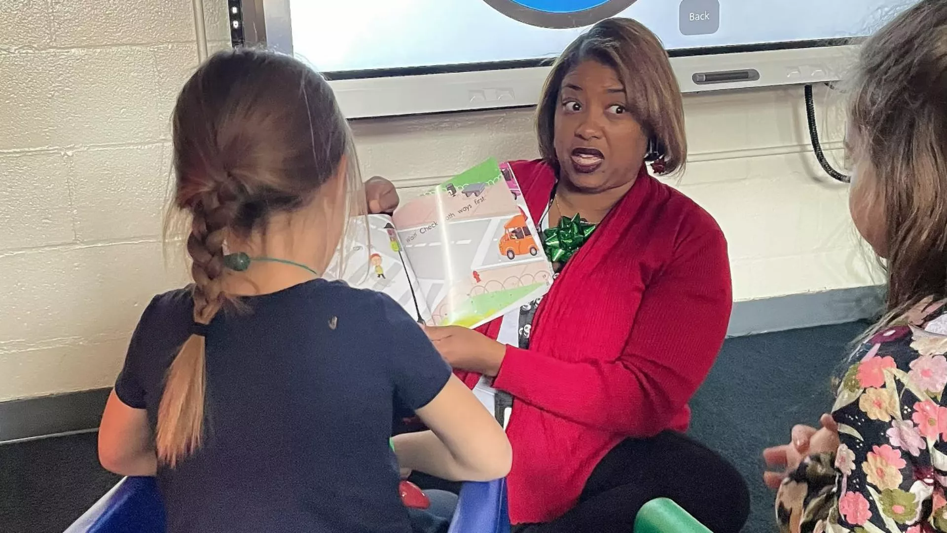 Kizzy Perkins reads to students