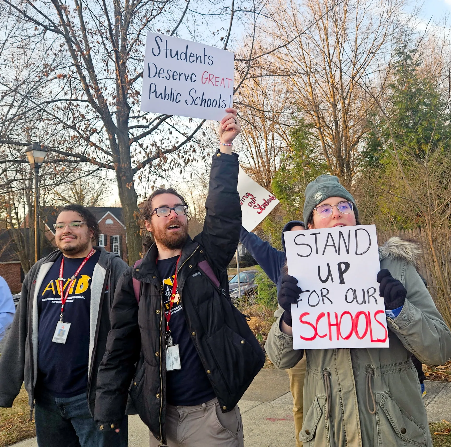 DSEA members hold signs advocating for our public schools