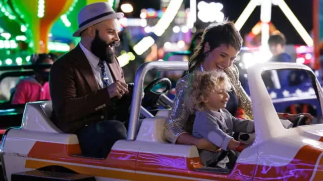 a family on a ride at an amusement park